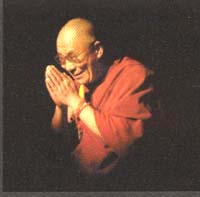 The Dalai Lama making a Buddhist hand position